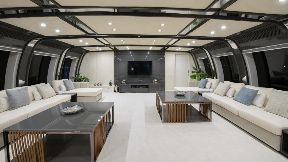 Modern luxury living area with stylish furniture and spot ceiling lighting of the luxury yacht
